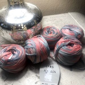 6 balls of Ribbon yarn . Variegated colors